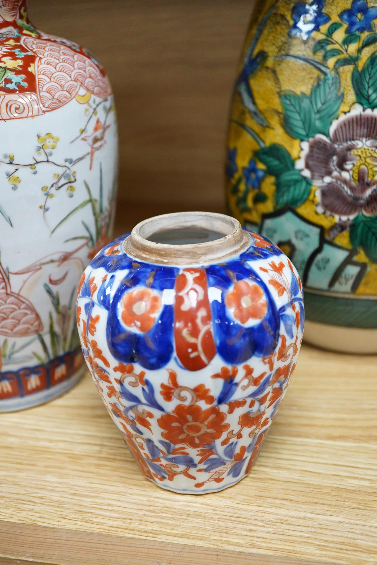 A Japanese green Kutani vase, a pair of Imari vases and smaller vase (4)